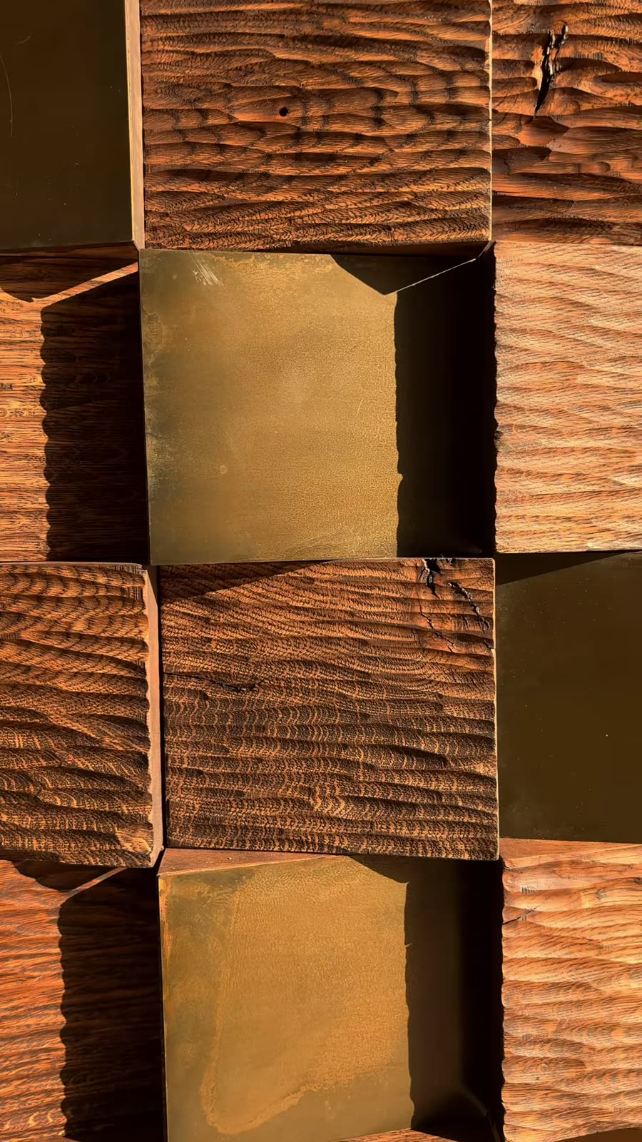 Carved timber blocks with gold-tone metal